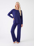 Woman wearing a Midnight blue bamboo loungewear set on a white background