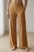 Woman wearing caramel bamboo wide-leg trousers loungewear 